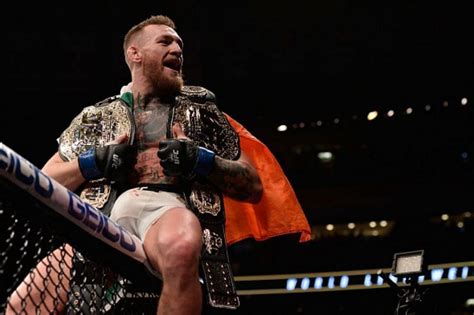 Who beat Conor McGregor for the UFC featherweight and lightweight b.